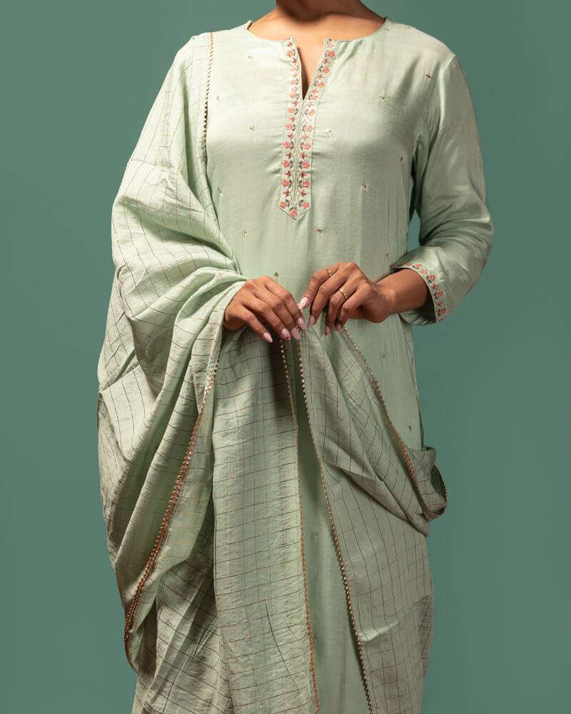 Sage green kurta set.